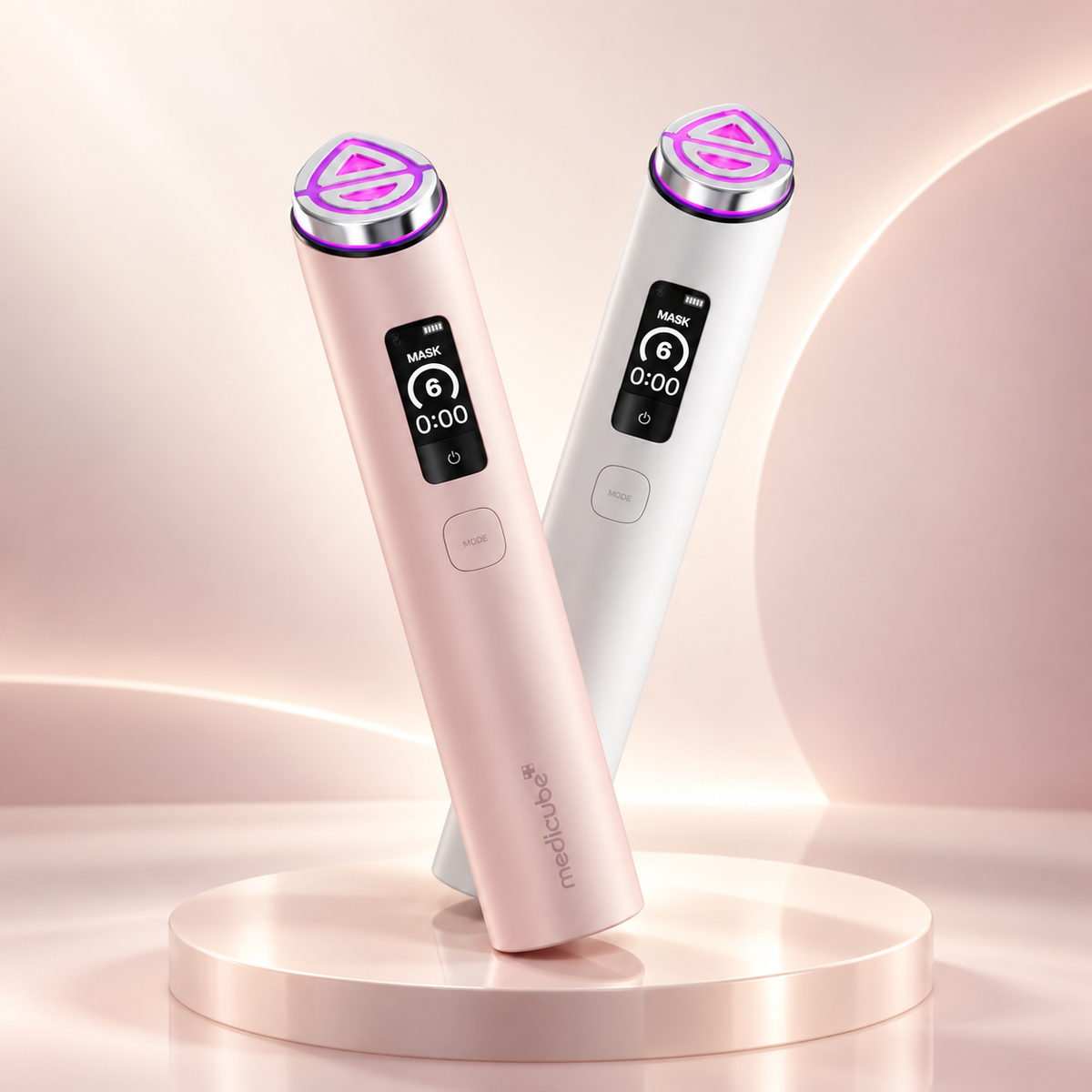 Medicube AGE-R Booster Pro X2 in pink and white on a premium blush studio background